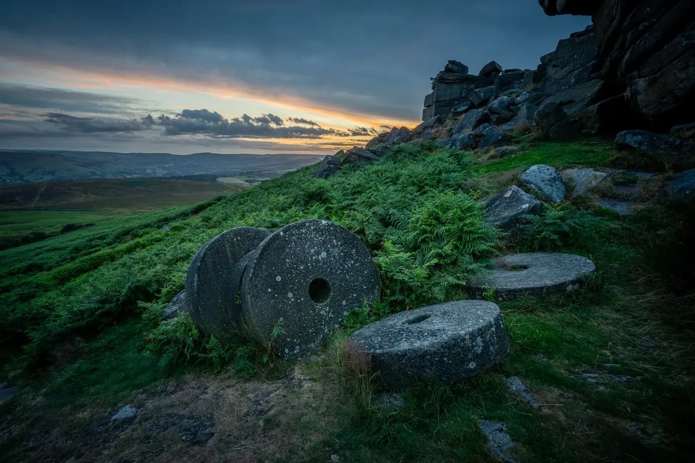Abandoned millstones below Stanage Edge at sunset