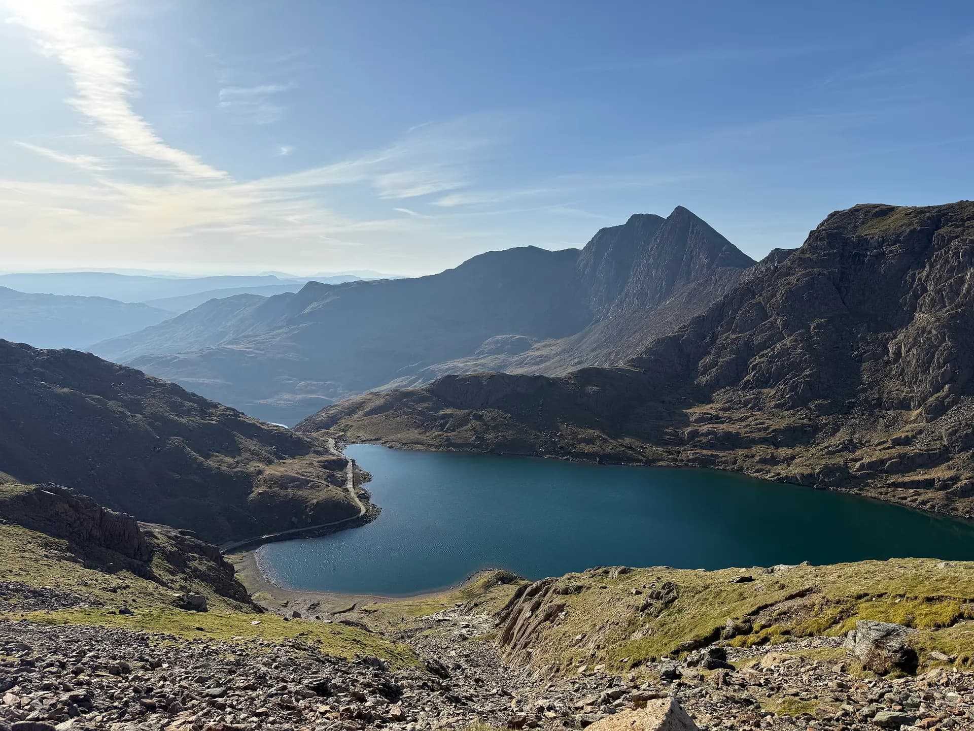 Yr Wyddfa's summit above Llyn Llydaw in early morning light, seen from the Pyg Track