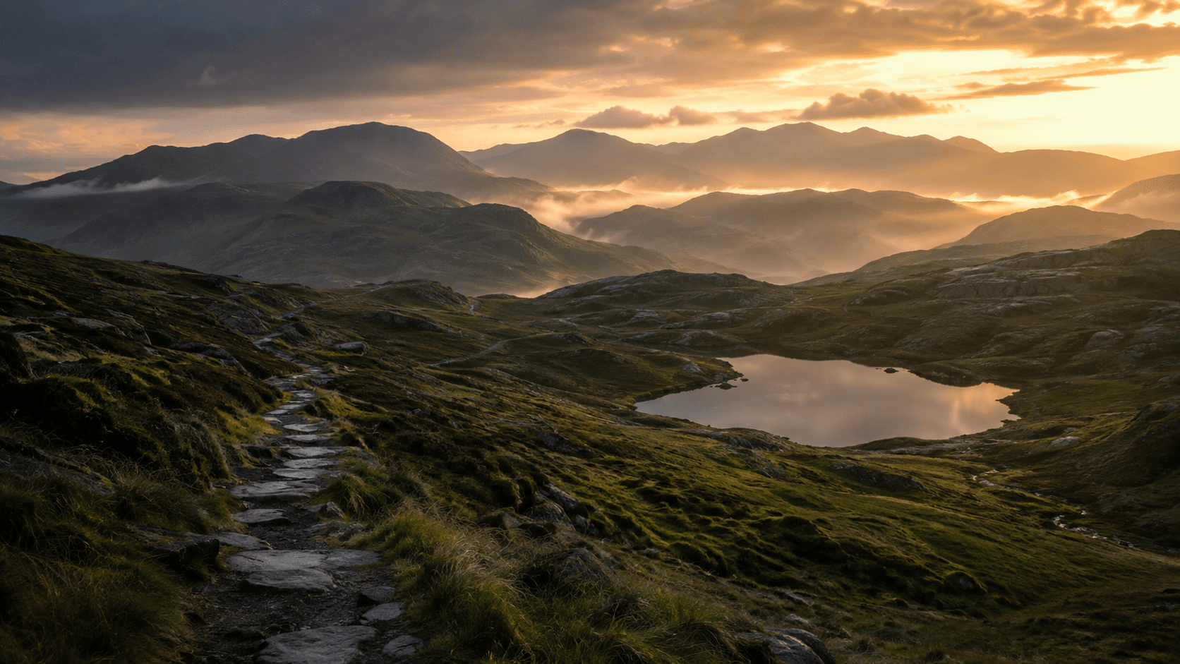 A path through the Lake District fells at sunrise