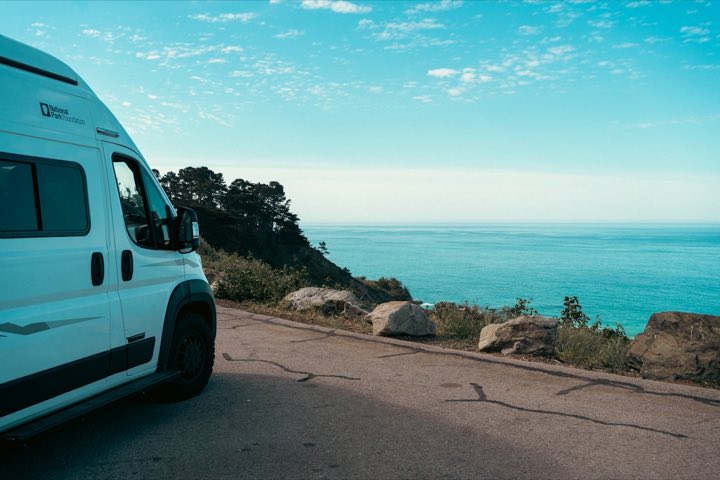 A campervan pulled over and parked on a quiet roadside