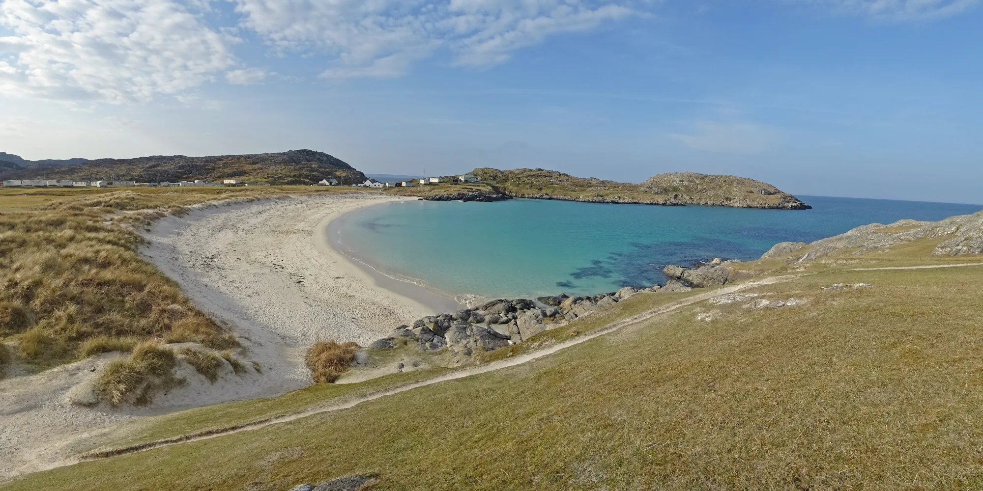 White sand and turquoise water at Achmelvich Beach in Assynt