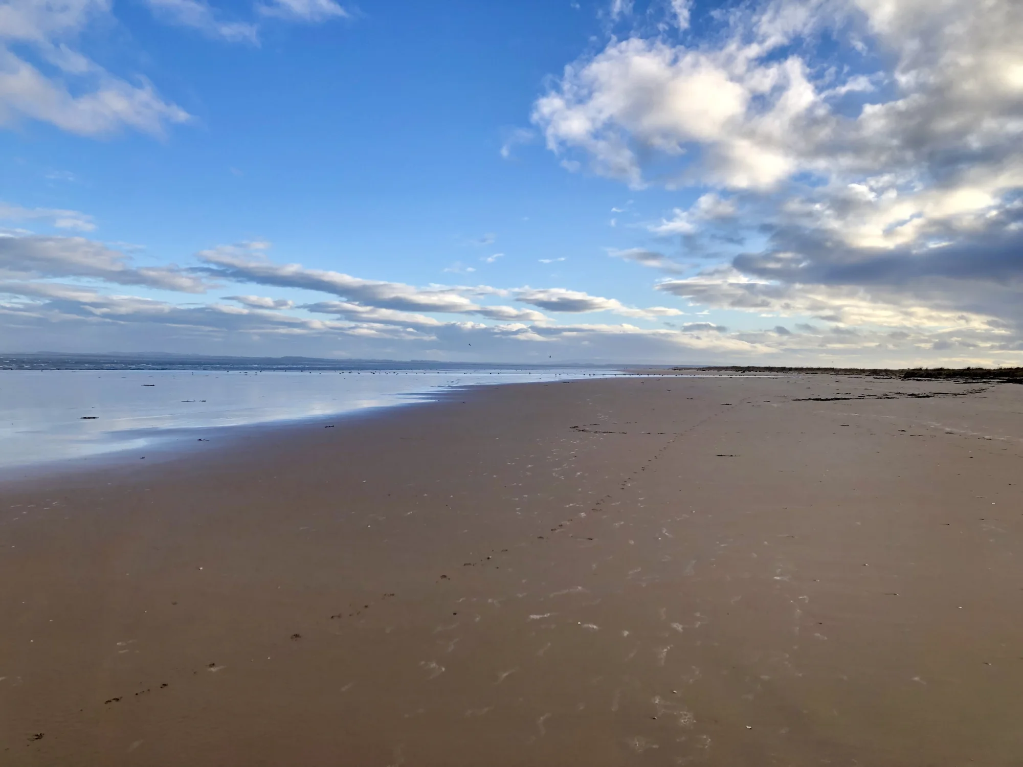 Wide sandy shoreline at Dornoch on the east coast of the NC500